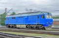 Blue locomotive diesel train at high speed rides by rail. Royalty Free Stock Photo