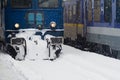 Blue locomotive train in railway station in winter time