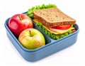 Blue Lunchbox Filled with Apple and Ham Sandwich with White Background Close Up Royalty Free Stock Photo
