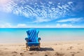 Blue luxury chair at the sandy beach, freelance business concept, generative ai