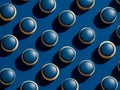 Blue macarons arranged in a grid on a dark blue background Royalty Free Stock Photo