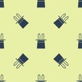 Blue Magician hat and rabbit ears icon isolated seamless pattern on yellow background. Magic trick. Mystery