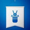 Blue Magician hat and rabbit icon isolated on blue background. Magic trick. Mystery entertainment concept. White pennant Royalty Free Stock Photo