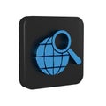 Blue Magnifying glass with globe icon isolated on transparent background. Analyzing the world. Global search sign. Black