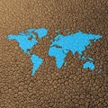 A blue map of the world is superimposed on a background of cracked, parched earth, Royalty Free Stock Photo