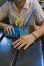 Blue marbles handmade bracelet and a cocktail Royalty Free Stock Photo