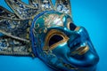 Blue Mardi Gras or carnival jester mask on a blue background