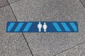 Blue marking indicating how much distance people should keep to be safe. 2.0 meters