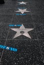  The Star sign of Tom Selleck and Blue marking on street