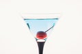 Blue martini cocktail with cherry on the rustic background Royalty Free Stock Photo