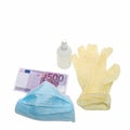 The blue mask lies with yellow protective medical gloves with an antiseptic and money of 500, five hundred euros. The concept of b Royalty Free Stock Photo