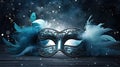 blue masquerade mask with fluffy white feathers and silver glitter. Royalty Free Stock Photo