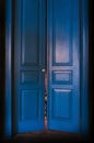 Blue massive vintage doors indoor.