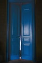 Blue massive vintage doors indoor.