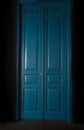 Blue massive vintage doors indoor.