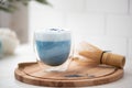 blue matcha tea with latte foam in a glass Royalty Free Stock Photo