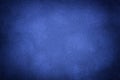 Blue matte background of suede fabric with vignette, closeup. Velvet textile Royalty Free Stock Photo