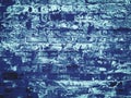 Blue, matte grunge texture of an old red brick wall with damage and peeling paint Royalty Free Stock Photo