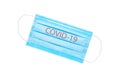 blue medical face mask with the inscription COVID-19 isolated on a white background. coronavirus pandemic