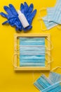 Blue medical face masks and disposable blue gloves with hand sanitizers