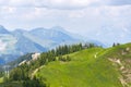 Blue medical helicopter flying over Alps near Wildenkarkogel, Saalbach, Austria Royalty Free Stock Photo