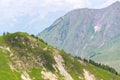 Blue medical helicopter flying over Alps near Wildenkarkogel, Saalbach, Austria Royalty Free Stock Photo