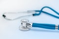 Blue medical stethoscope or phonendoscope on white background Royalty Free Stock Photo