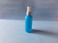 A blue medicine bottle isolated on a white surface Royalty Free Stock Photo