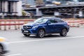 Blue Mercedes-Benz GLE Class cope on the city road. Fast moving Mercedes GLE 400 4MATIC on Moscow streets with motion blur.