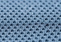 Blue mesh fabric with a grid pattern, featuring evenly spaced open-air Royalty Free Stock Photo