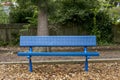 Blue metal bench in public park Royalty Free Stock Photo