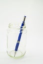 Blue Metal Drafting Pencil in a clear jar Isolated on White Background