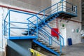 Blue metal ladder in an old factory