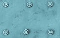 Blue metal plate painted with light blue cyan colours and fixed with six large steel bolt screws texture background Royalty Free Stock Photo