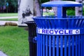 Blue Metal Recycling Bin in a Park Royalty Free Stock Photo