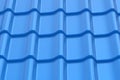 Blue metal roof tile. Contemporary roofing system. Building materials. Type of house cover. Close up Royalty Free Stock Photo