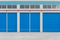 Blue metal shutter doors on commercial shop