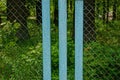 Blue metal texture from three plates and an iron mesh on the street