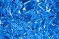 Blue metallic foil shiny texture, wrinkled wrapping paper for background and design art work Royalty Free Stock Photo