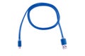 Blue micro-usb cable twisted into a ring, on a white isolated background. Horizontal frame Royalty Free Stock Photo