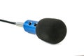 Blue microphone with black wire isolated on white background Royalty Free Stock Photo