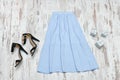 Blue midi skirt and black shoes. Fashionable concept