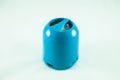 Blue mini portable speaker on a white backrground. Royalty Free Stock Photo