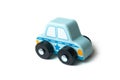 blue miniature wooden car on white background - concept police patrol Royalty Free Stock Photo