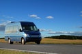 Blue minibus on highway Royalty Free Stock Photo