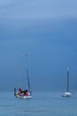 Three boats under the blue misty sky Royalty Free Stock Photo