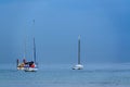 Horizontal  photo of the three boats under the blue misty sky Royalty Free Stock Photo