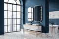 Blue modern hotel bathroom interior with double sink and tub, panoramic window Royalty Free Stock Photo