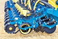 Modern blue multi-row seeder used in the agricultural sector