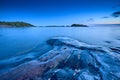 Blue moment in the rocky seashore Royalty Free Stock Photo